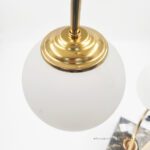 جزئیات اتصال حباب شیشه‌ای مات و قطعه فلزی طلایی آباژور مدل آرک