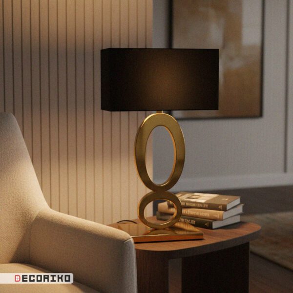 آباژور رومیزی طلایی مدرن مدل بیضی کنار مبل راحتی