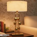 آباژور رومیزی استیل طلایی مدل توپی با شید کرم روشن