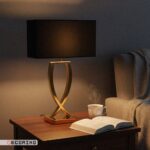 آباژور رومیزی مدرن مدل نیوا با پایه استیل طلایی و شید مشکی